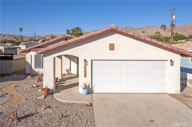 single story home featuring a garage