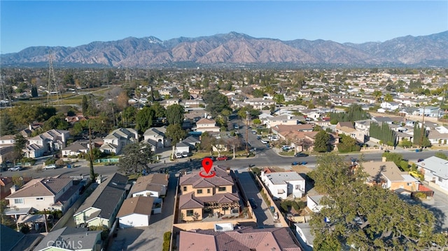 birds eye view of property with a mountain view