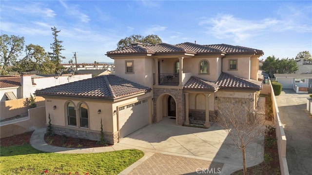 mediterranean / spanish-style home with a balcony