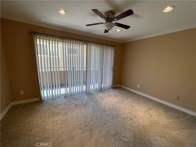 empty room featuring ceiling fan, carpet flooring, and crown molding