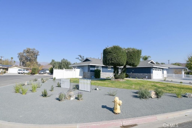 ranch-style home featuring a garage