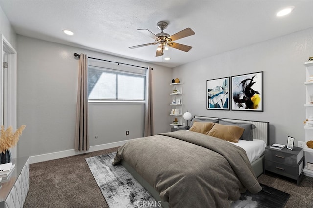 bedroom featuring ceiling fan and dark colored carpet