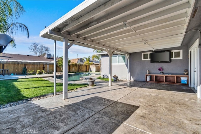 view of patio with a fenced in pool