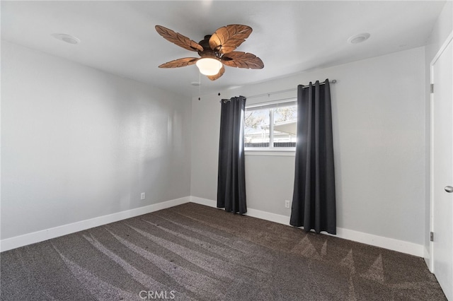 empty room with ceiling fan and carpet