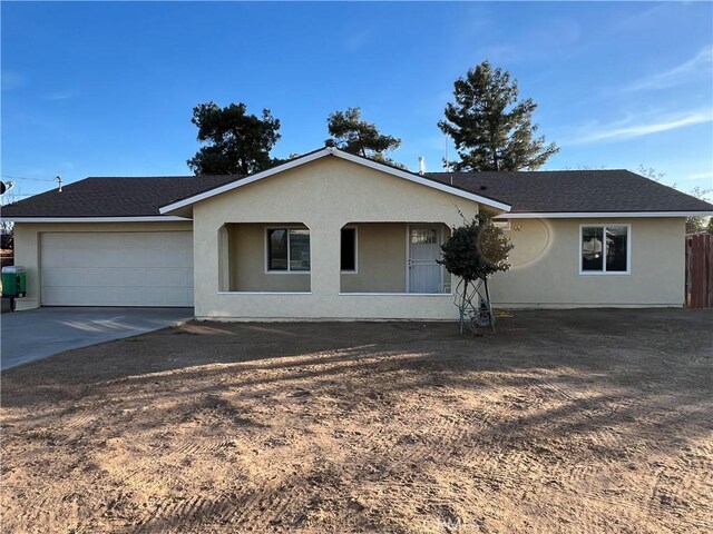 ranch-style house featuring a garage