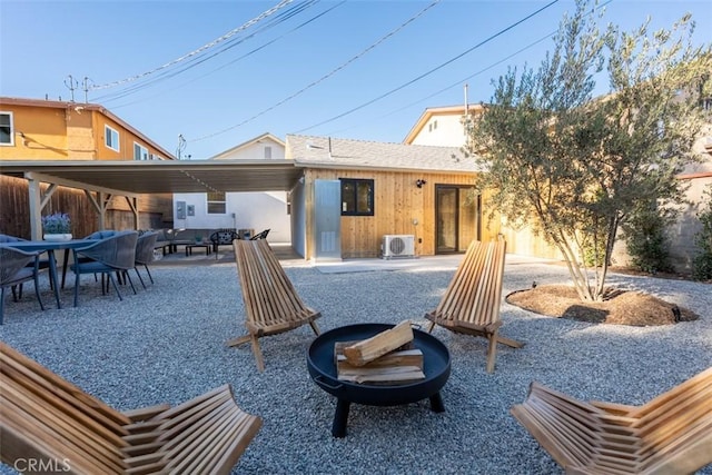 back of property featuring ac unit and a patio area