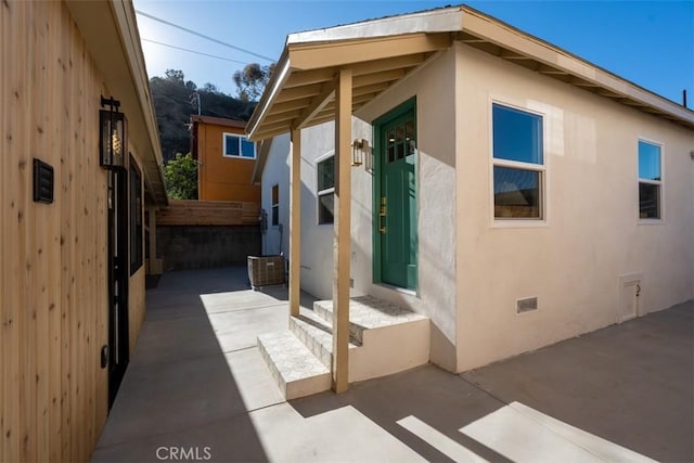 view of side of property with a patio area