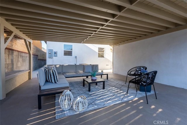 view of patio with an outdoor hangout area and electric panel