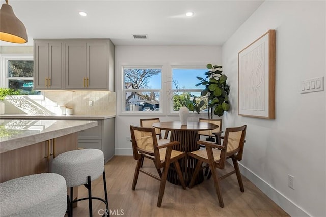 dining area with light hardwood / wood-style flooring