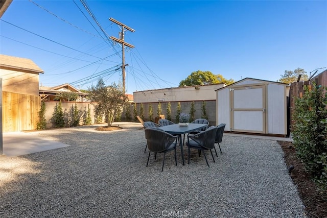 view of patio / terrace featuring a storage shed