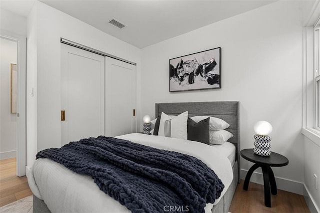 bedroom featuring a closet and hardwood / wood-style flooring