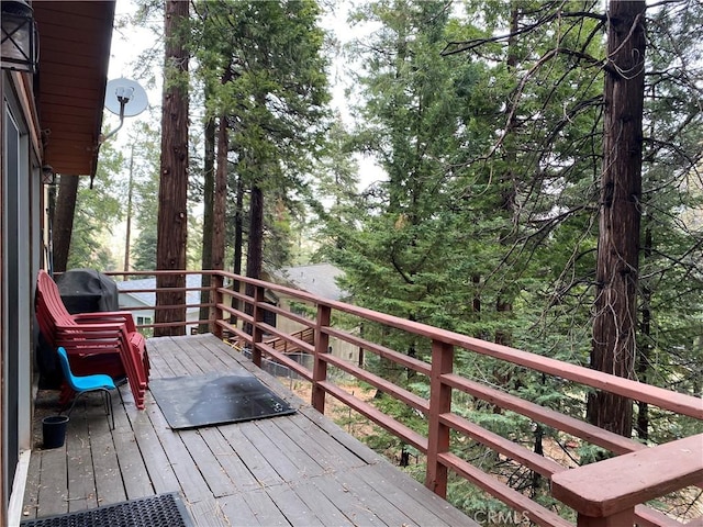 wooden terrace featuring area for grilling