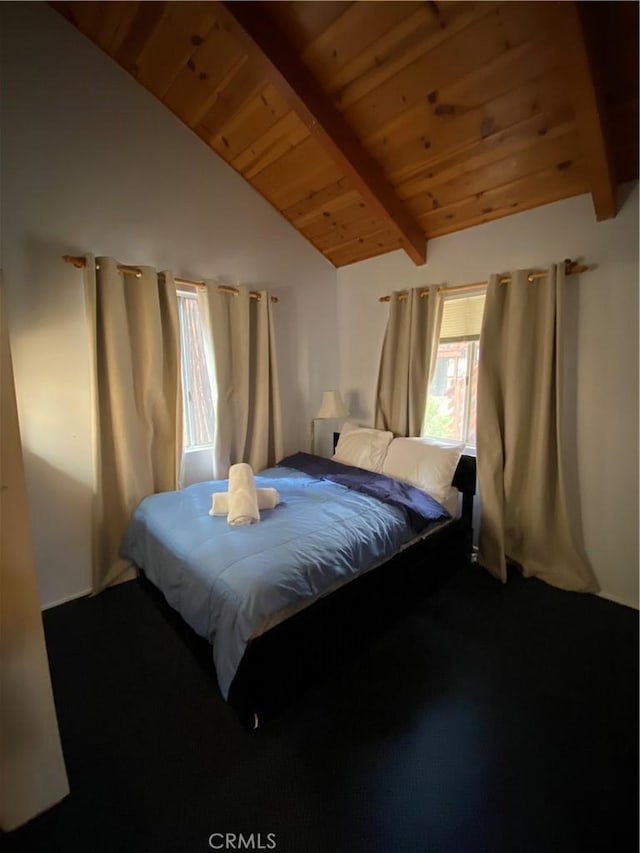 bedroom featuring wood ceiling and vaulted ceiling with beams