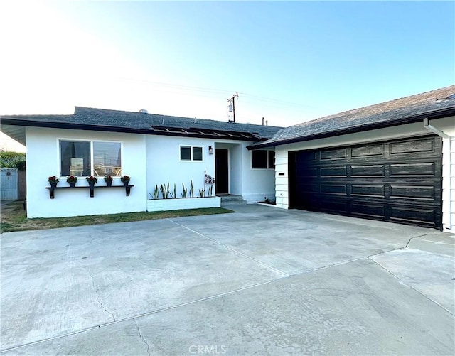 ranch-style home featuring a garage