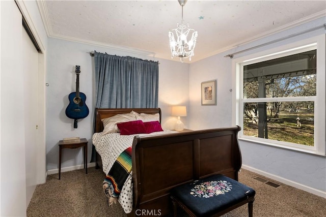 bedroom featuring an inviting chandelier, crown molding, and carpet floors