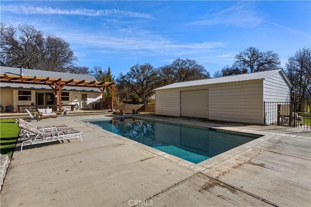 view of pool with a pergola, a patio area, and an outdoor structure