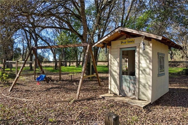 view of outbuilding with a playground