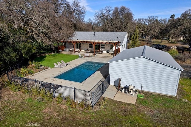 back of house with a fenced in pool, a patio area, and a yard