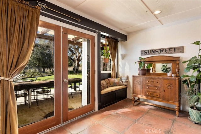 doorway with tile patterned floors