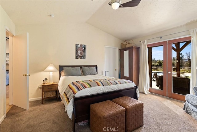 carpeted bedroom featuring ceiling fan, access to exterior, french doors, and vaulted ceiling