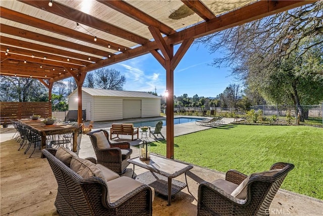 view of patio / terrace featuring an outbuilding and a fenced in pool