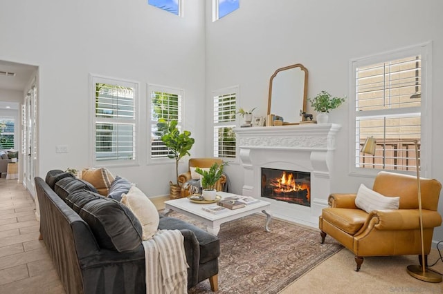 living room with a towering ceiling and a wealth of natural light