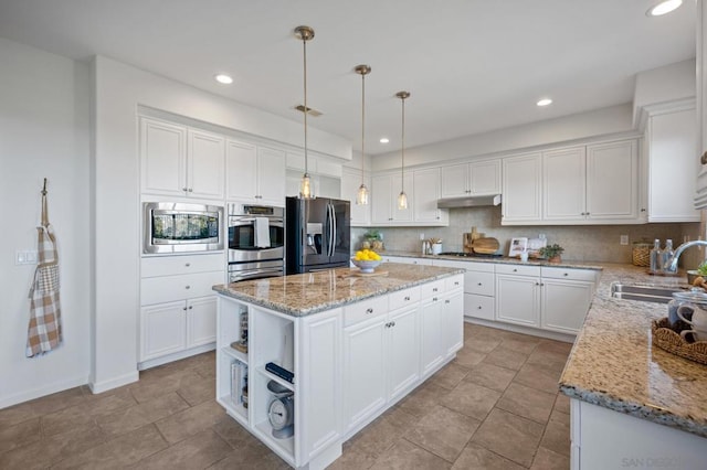 kitchen with pendant lighting, a center island, white cabinetry, appliances with stainless steel finishes, and sink