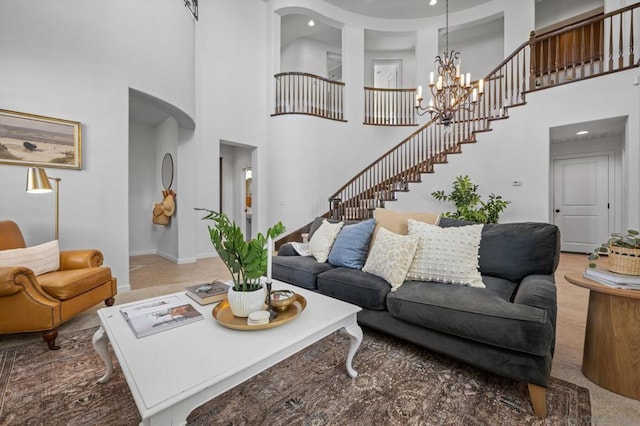 living room with a high ceiling and a notable chandelier