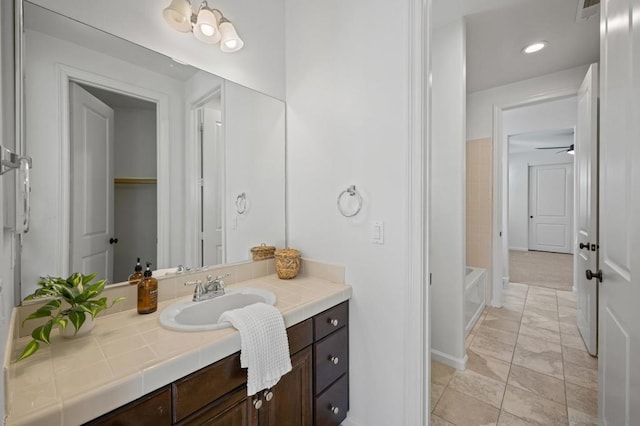 bathroom with vanity and ceiling fan