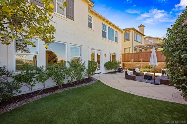 exterior space featuring an outdoor hangout area and a patio