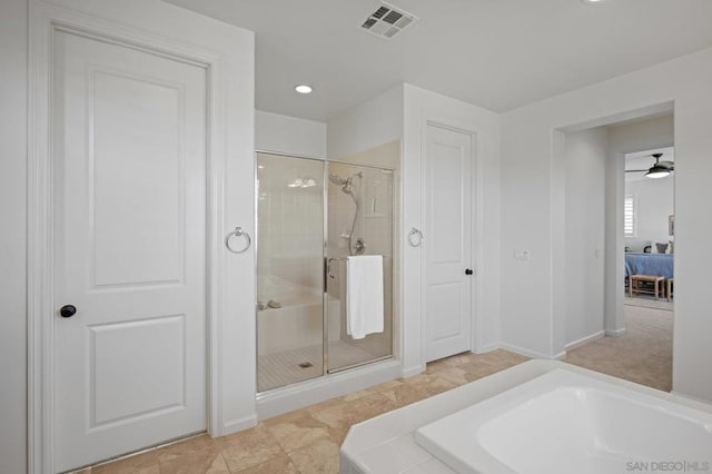 bathroom with ceiling fan and plus walk in shower