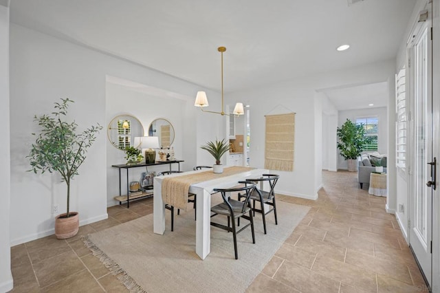 dining space with a chandelier