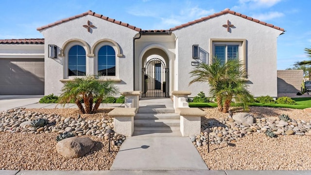 mediterranean / spanish house featuring a garage