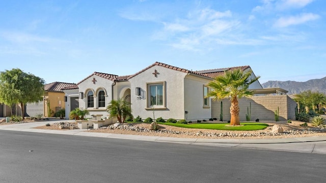 mediterranean / spanish home with a mountain view