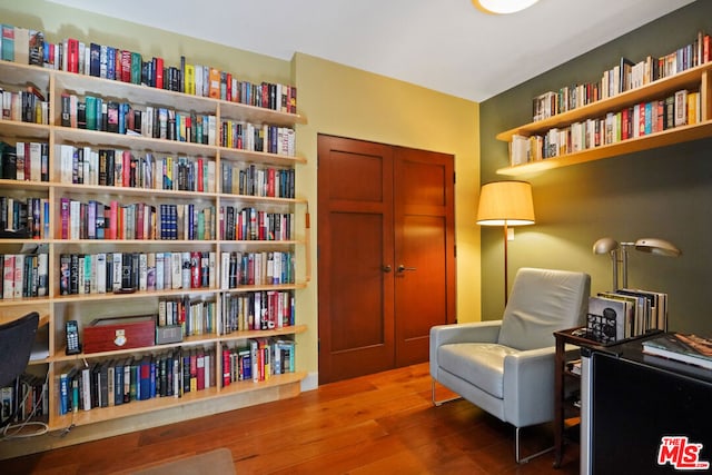 sitting room with hardwood / wood-style floors