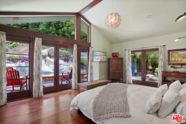 bedroom with french doors, hardwood / wood-style flooring, high vaulted ceiling, and access to outside