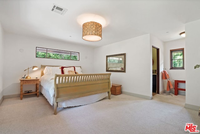 bedroom with light colored carpet