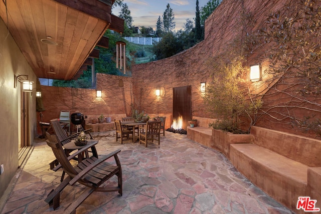 view of patio terrace at dusk