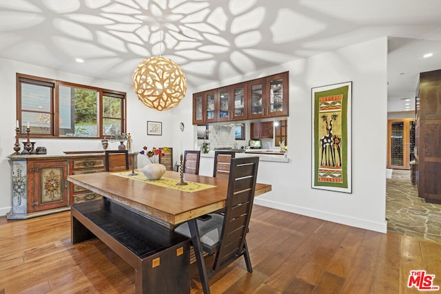 dining area with hardwood / wood-style floors