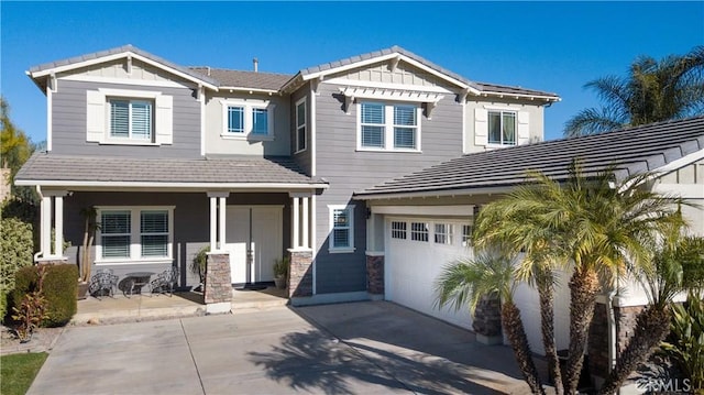 craftsman-style home featuring a garage and covered porch