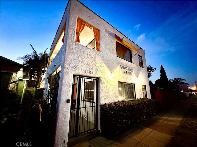 view of property exterior at dusk