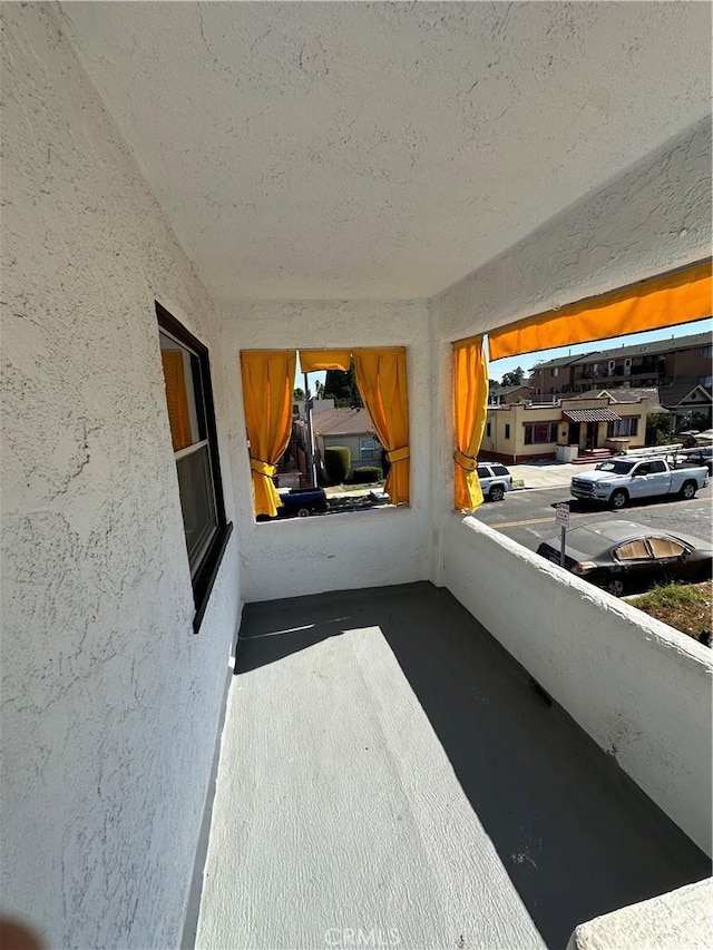 view of patio with a balcony