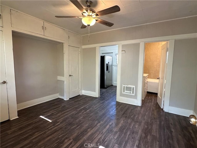 unfurnished bedroom featuring stainless steel refrigerator with ice dispenser, dark hardwood / wood-style floors, a closet, and ceiling fan