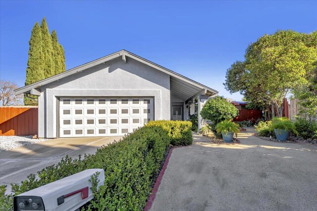 view of front of property with a garage