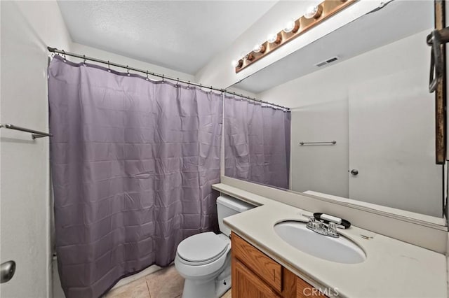 bathroom with toilet, a shower with shower curtain, tile patterned flooring, a textured ceiling, and vanity