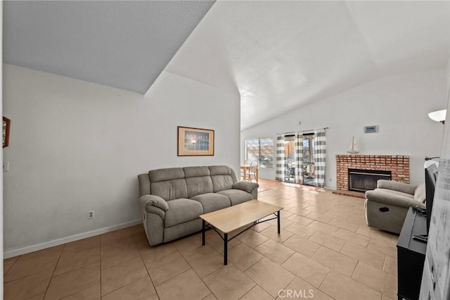 tiled living room featuring vaulted ceiling and a brick fireplace