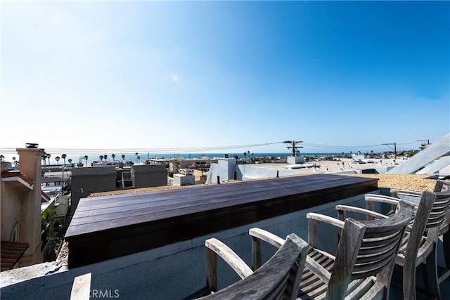 wooden terrace with a water view