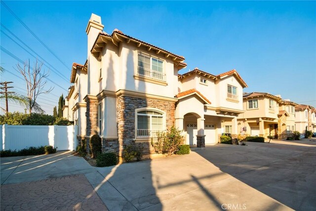 mediterranean / spanish house with a garage