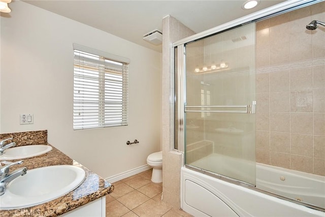 full bathroom with tile patterned flooring, vanity, toilet, and enclosed tub / shower combo