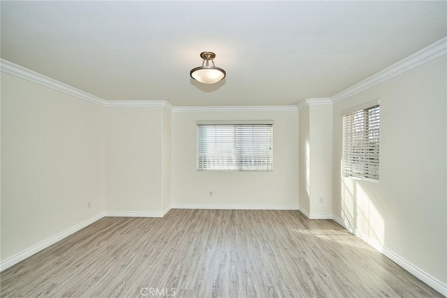 unfurnished room with light wood-type flooring and crown molding